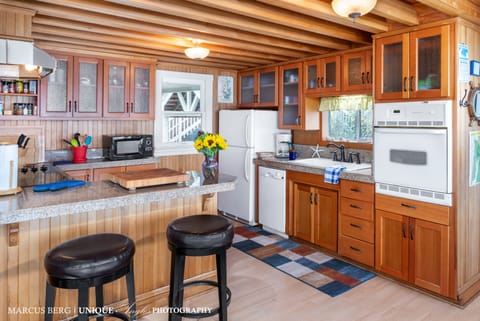Beachfront Kitchen - Beautiful new fir cabinetry and granite counters.  Every supply you'd need to create a beautiful oceanfront meal for the gang.