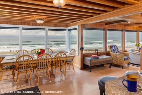 Dining, kitchen and living room are front row to the beach. - Exciting wild surf in the Winter or soothing rolling waves in the Summer.   This house has wall to wall views of the beach and surf.