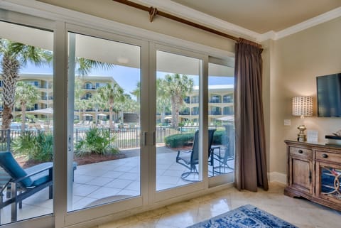 Living Room - Sliding glass doors from the living room leading to the patio over looking the 8,000 square foot pool