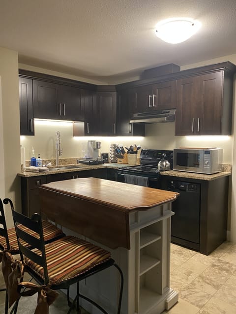 Well lit kitchen with all the amenities. 