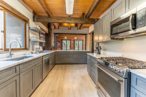 Updated full size kitchen with granite countertops, hardwood flooring and new stainless steel appliances throughout.