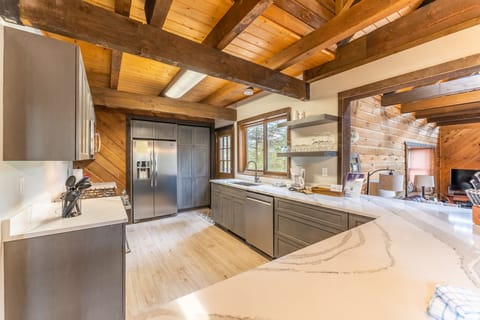 Updated full size kitchen with granite countertops, hardwood flooring and new stainless steel appliances throughout.