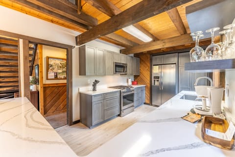 Updated full size kitchen with granite countertops, hardwood flooring and new stainless steel appliances throughout.