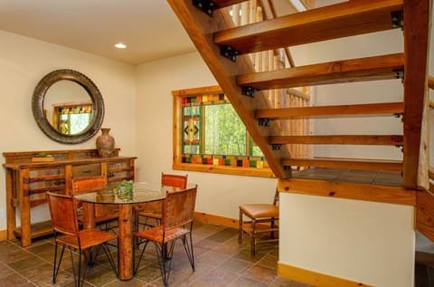 Breakfast nook for four at the bottom of the stairs