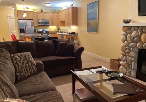 Living room with river rock gas fireplace