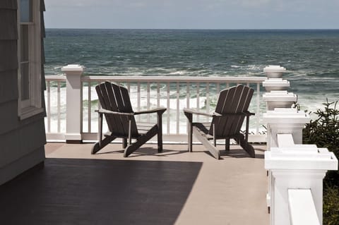 Deck view wraps around with 10 wooden chairs - Huge ocean views and 10 wooden chairs!