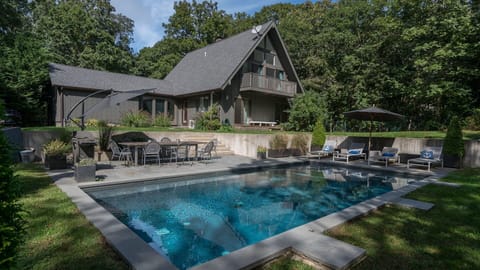 A heated pool, sun loungers