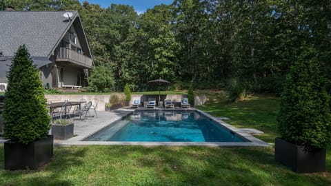 A heated pool, sun loungers