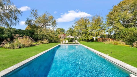 A heated pool, pool umbrellas, sun loungers