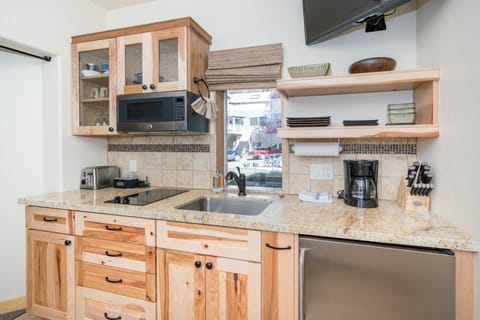 The kitchenette has a cooktop, microwave, toaster, coffee maker & mini fridge! Great for all your basic cooking needs.