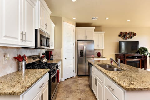 Kitchen - The Kitchen is complete with everything you will need for meal preparations including pots, pans, baking dishes, plates, cups, silverware, cutlery, and an assortment of cooking utensils