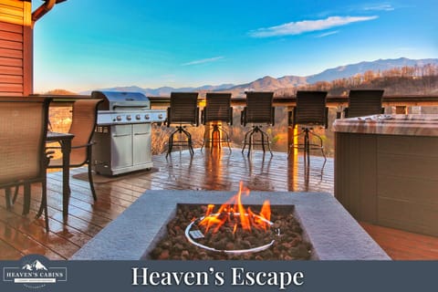 Massive deck with Hot Tub, Fire Pit, Bar Stools, Grill, and Dining