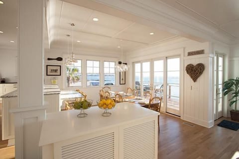 Oceanfront dining at huge barnwood family table.