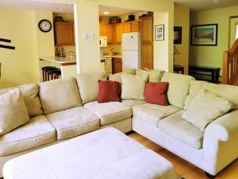 Living area towards kitchen and entry hall