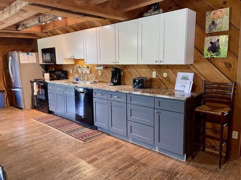 Fully equipped kitchen including a standard coffee maker