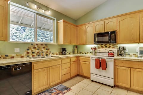 The main house kitchen has all the appliances and utensils you need for feeding the whole family.