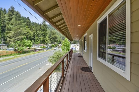 The front deck - facing the road - is the primary entrance to the main house and suite.