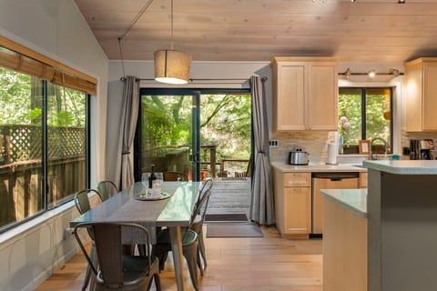 Dining area with redwood views and slider to the back deck