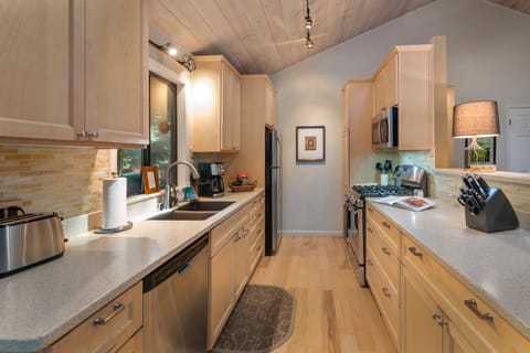 Recently remodeled kitchen faces the back deck.