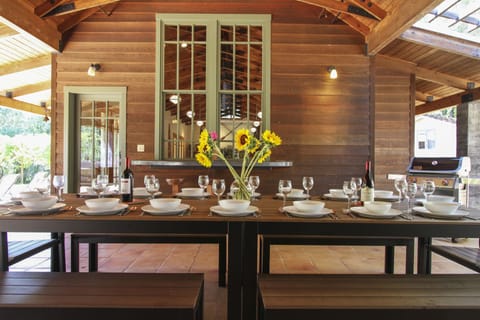 Covered outdoor dining at the Pool House.