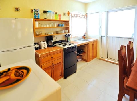 Kitchen - Well equipped kitchen and door to pool patio area.