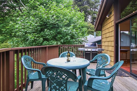 Outdoor dining and BBQ on the back deck overlooking the yard.