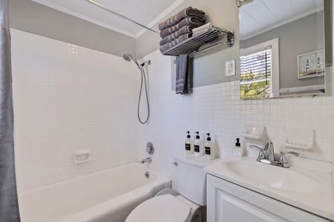 Bathtub, hair dryer, towels