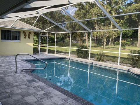 A heated pool, sun loungers