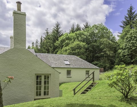 Gardener's Cottage - side aspect with steps leading up to the lawned garden