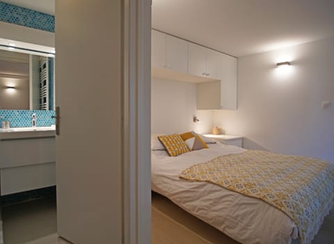 Bedroom 4 with double bed and 2 single beds and an ensuite shower room and WC