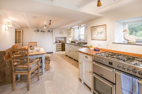 Abbey House - the bright kitchen with breakfast dining space - please note the cooker is now electric with a ceramic hob