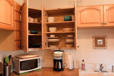 Microwave, oven, coffee/tea maker, cookware/dishes/utensils