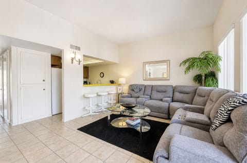 Sink into the plush sectional sofa and unwind in your bright, open living space—perfect for relaxing after a day of adventure.