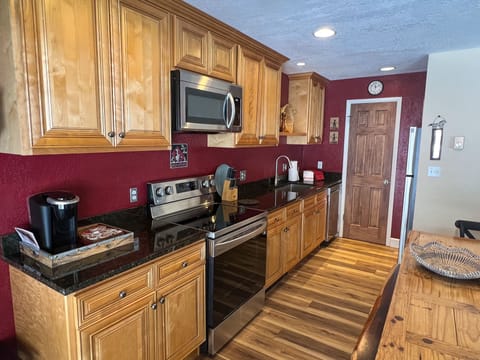 Our newly renovated kitchen featuring new appliance and cabinets