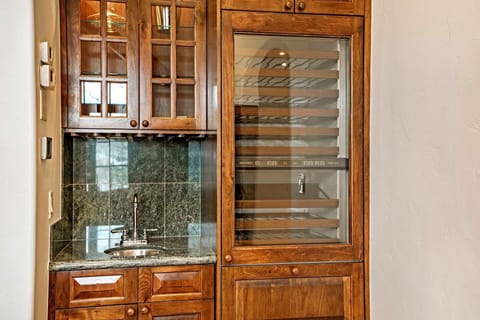 Enjoy the convenience of the wet bar and wine fridge in the living room.