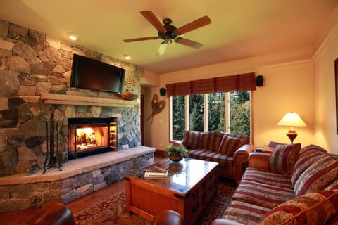 Living Room: Stone, wood-burning fireplace, 42' HDTV, big mountain views