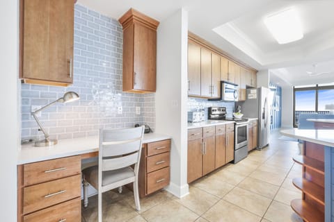 This kitchen features cozy workspace with a view, comfortable seating, a desk lamp, and complimentary WiFi during your stay