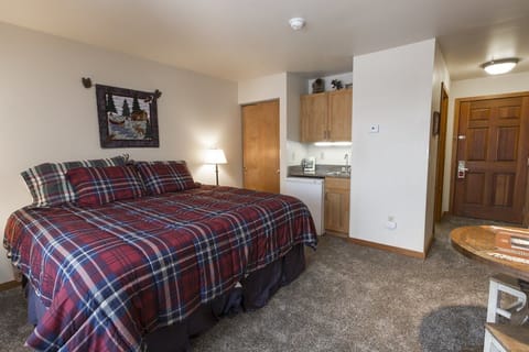 Split king bed and a wet bar with microwave, mini refrigerator, and coffeemaker.