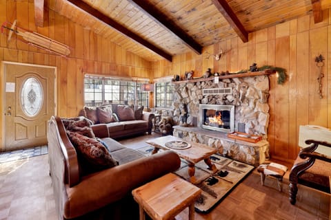 A bright living room with large windows, comfortable seating, and neutral décor. The open layout invites relaxation and conversation, perfect for family gatherings or quiet evenings.