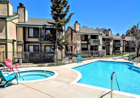 In addition to the large swimming pool, guests can enjoy a soothing soak in the adjacent hot tub. This gated outdoor facility is an ideal place to unwind after a long day of exploring.