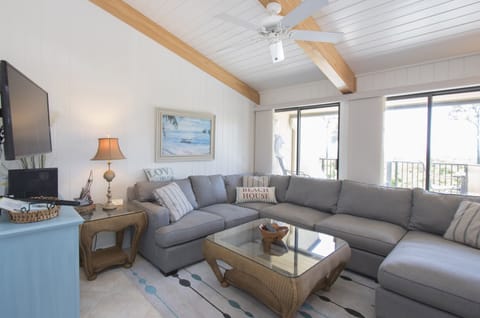 Hilton Head Beach Villa #3 - The newly furnished villa has a large wrap around couch and ceiling fan to keep you cool on those warm afternoons.