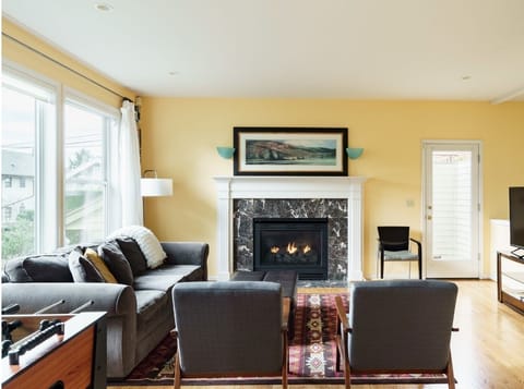 Living room seats large groups. Enjoy a game or a show on the smart TV.