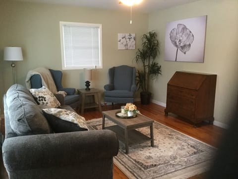 Large living room with comfortable furnishings. Make it home!
