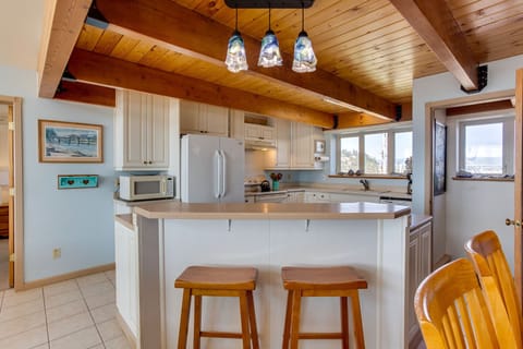 Sit at the breakfast bar and watch the cooks in the kitchen.