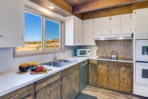 Well appointed kitchen for cooking at home all with ocean view.
