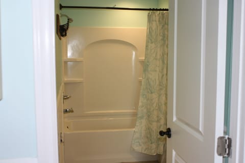 Combined shower/tub, hair dryer, soap, toilet paper