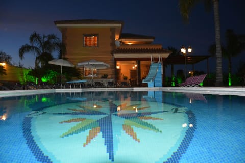 Outdoor pool, a heated pool, sun loungers