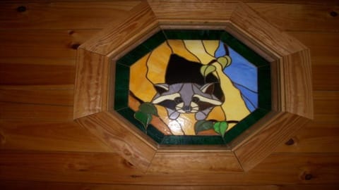 The Racoons Den stained glass window.
