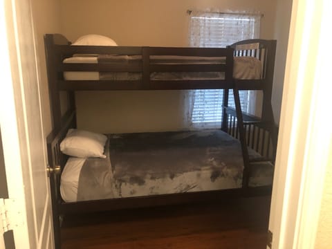 Guest bedroom with bunk beds. Full bed on bottom twin bed on top. Sleeps 2-3 ppl