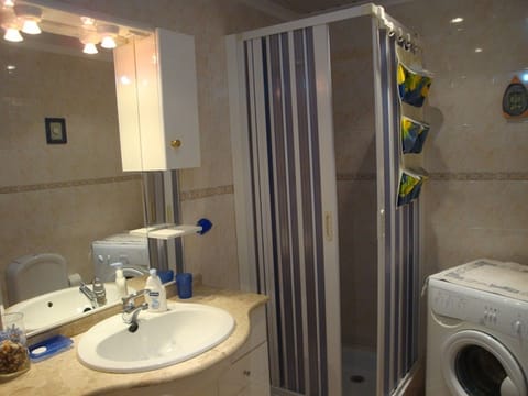 Combined shower/tub, hair dryer, towels, toilet paper